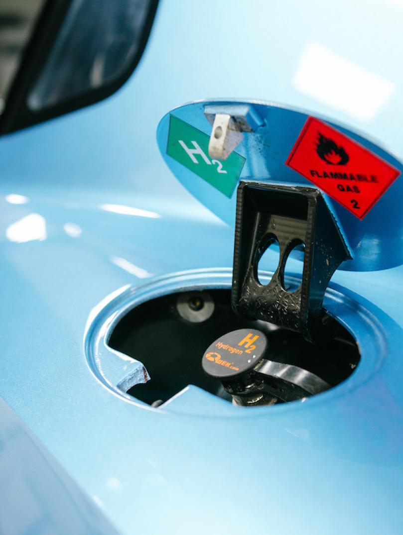 Car fuel cap open for hydrogen
