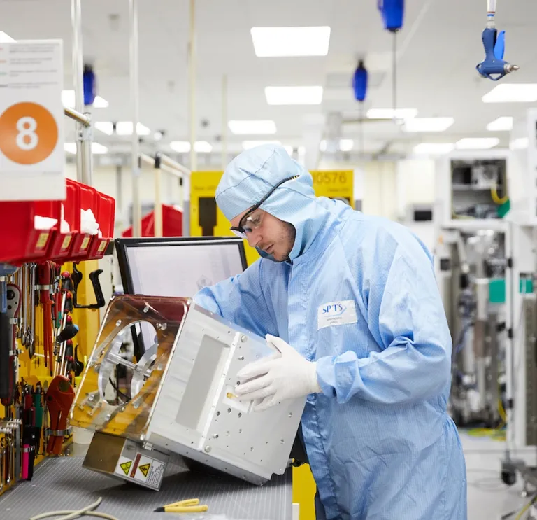 Man in overalls on a production line