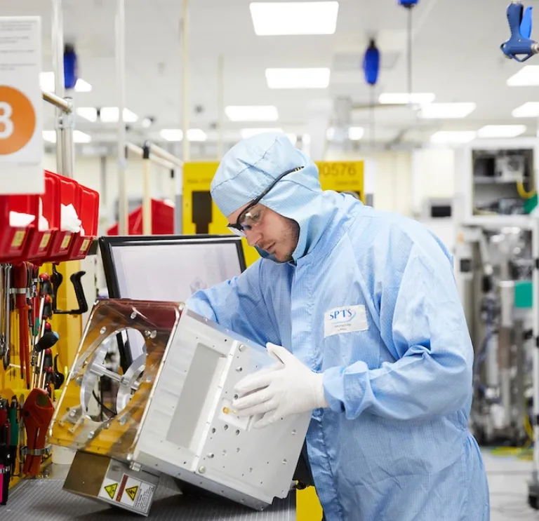 Man in overalls on a production line