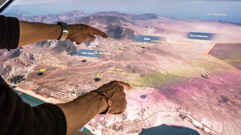 Pointing to the landscape on a screen