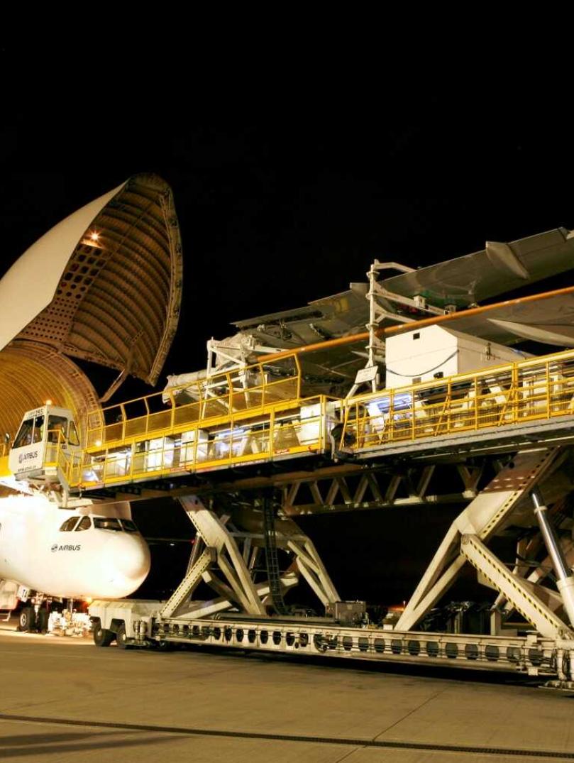 Wing being loaded onto an aircraft