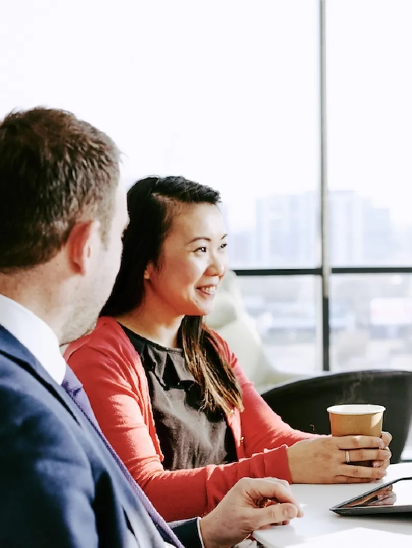Three people in a meeting
