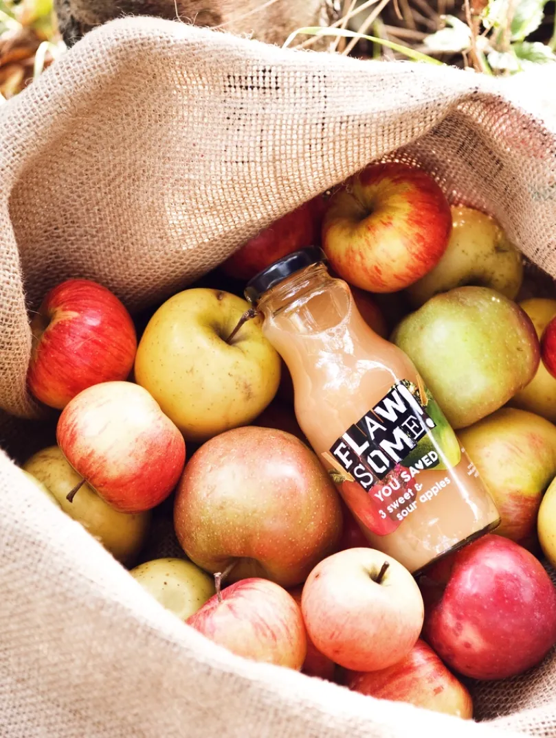 Bottle in a bag of apples