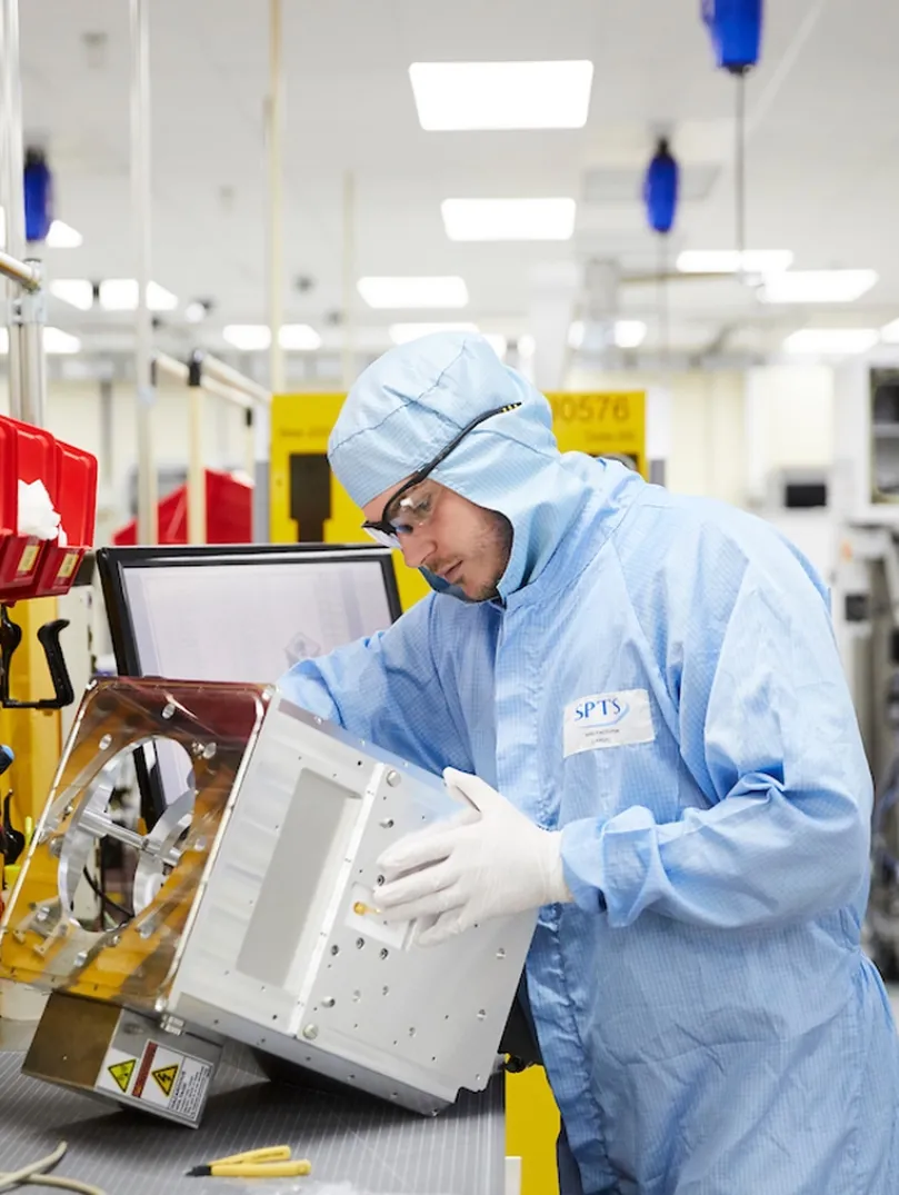Man in overalls on a production line