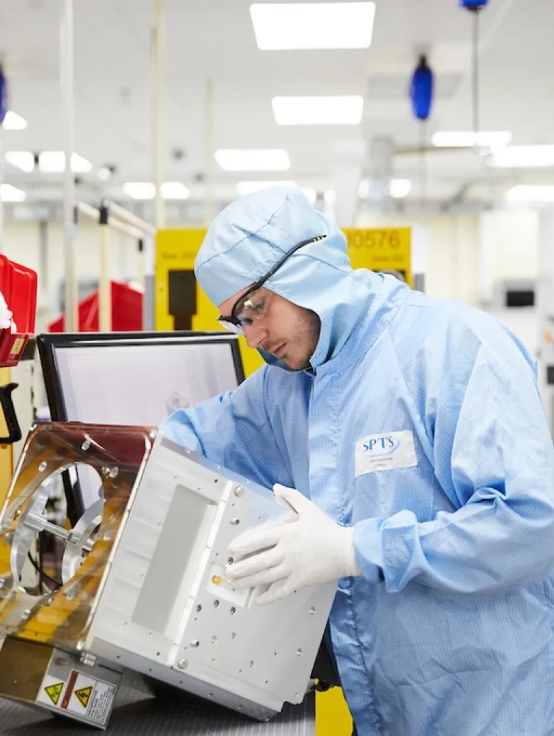 Man in overalls on a production line