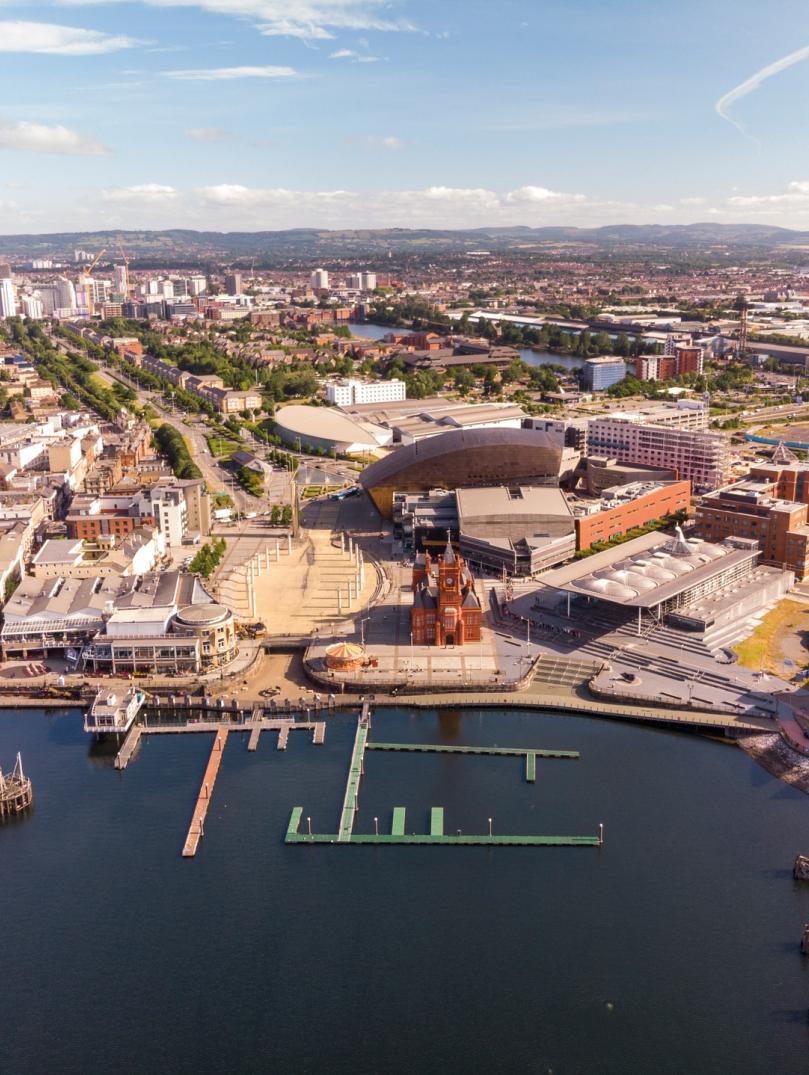 Cardiff Bay aerial photo including Pierhead Building, Wales Millennium Centre, Roald Dahl Plas/Oval Basin, Senedd, Tŷ Hywel