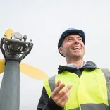 Man by a wind turbine
