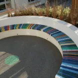 Circular bench with striped seats 