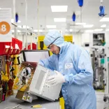 Man in overalls on a production line