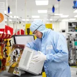 Man in overalls on a production line