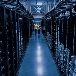 2 people walking through a data centre