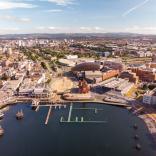Cardiff Bay aerial photo including Pierhead Building, Wales Millennium Centre, Roald Dahl Plas/Oval Basin, Senedd, Tŷ Hywel