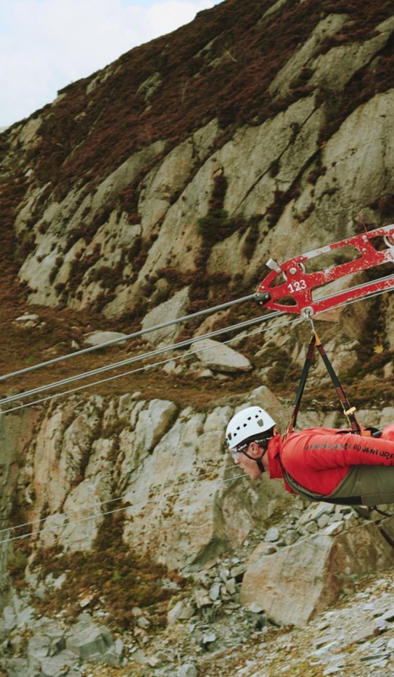 3 people on Zip lines at Zip World