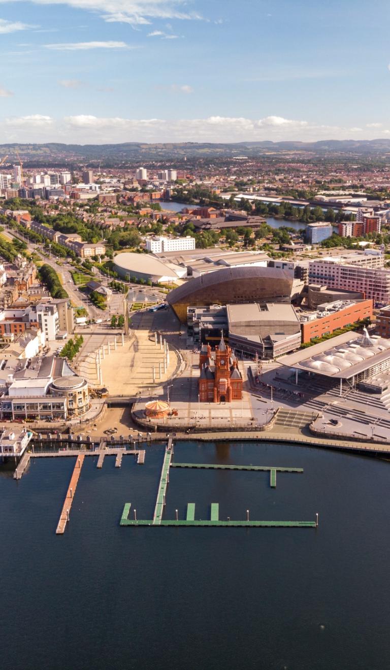 Cardiff Bay aerial photo including Pierhead Building, Wales Millennium Centre, Roald Dahl Plas/Oval Basin, Senedd, Tŷ Hywel